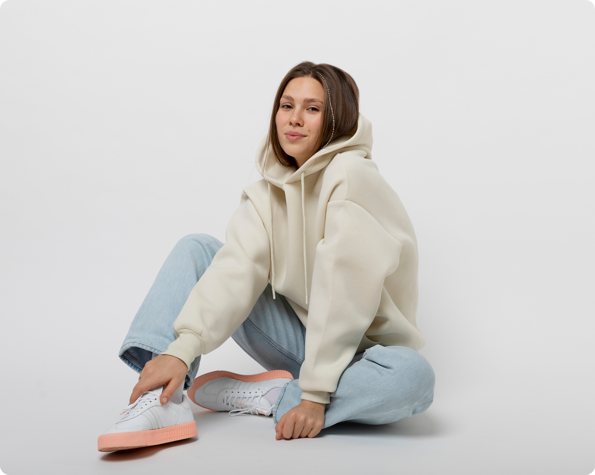Model wearing a relaxed fleece pullover hoodie