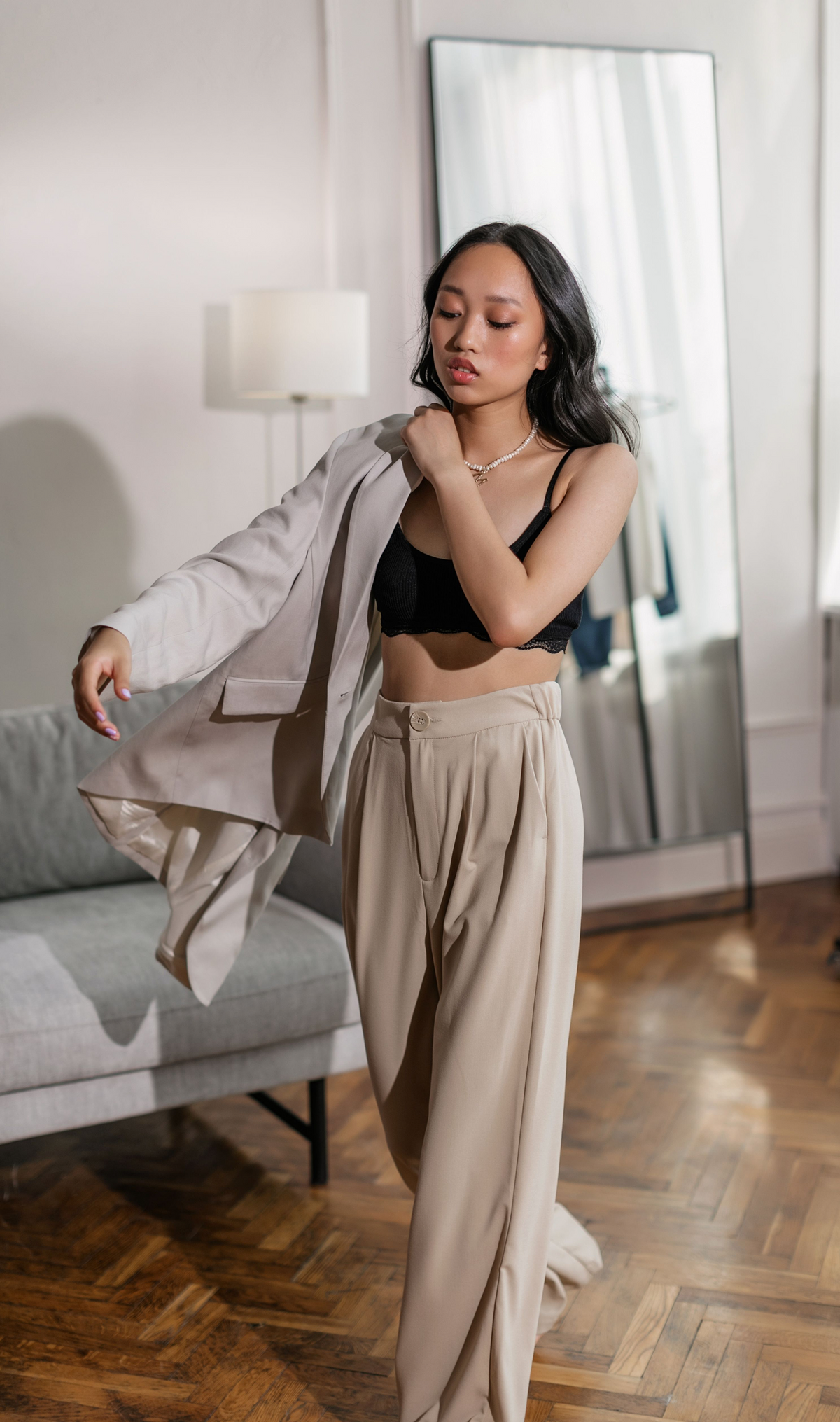 Model wearing a relaxed tailoring set with a blazer and wide-leg trousers