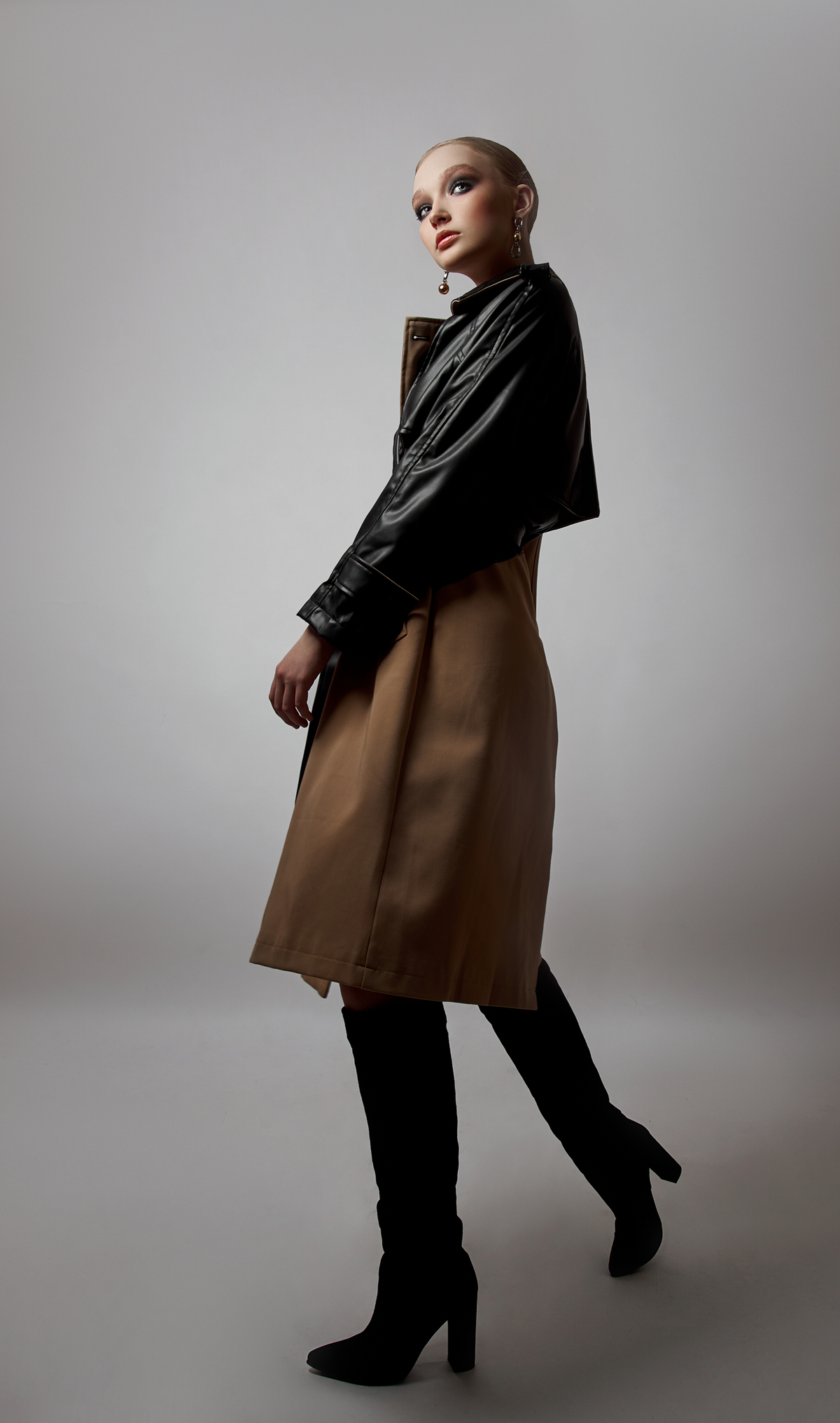 Model wearing a layered midi ensemble with a cropped jacket and midi-length skirt