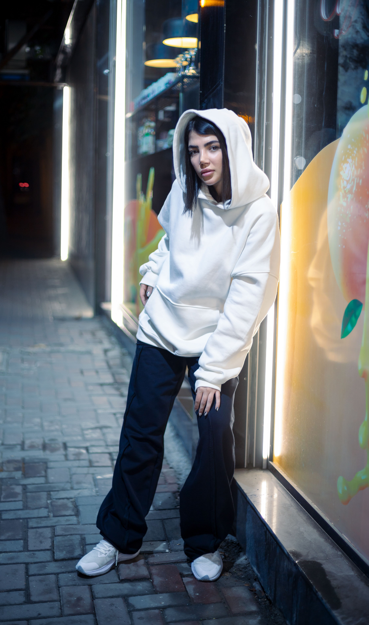 Model wearing an everyday pullover hoodie with a roomy hood and kangaroo pocket