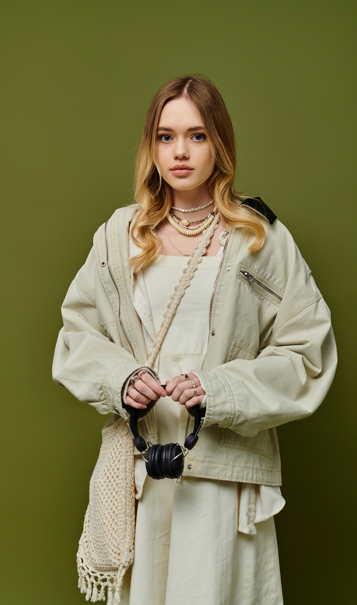 Model wearing a relaxed utility zip jacket with roomy sleeves and functional pockets