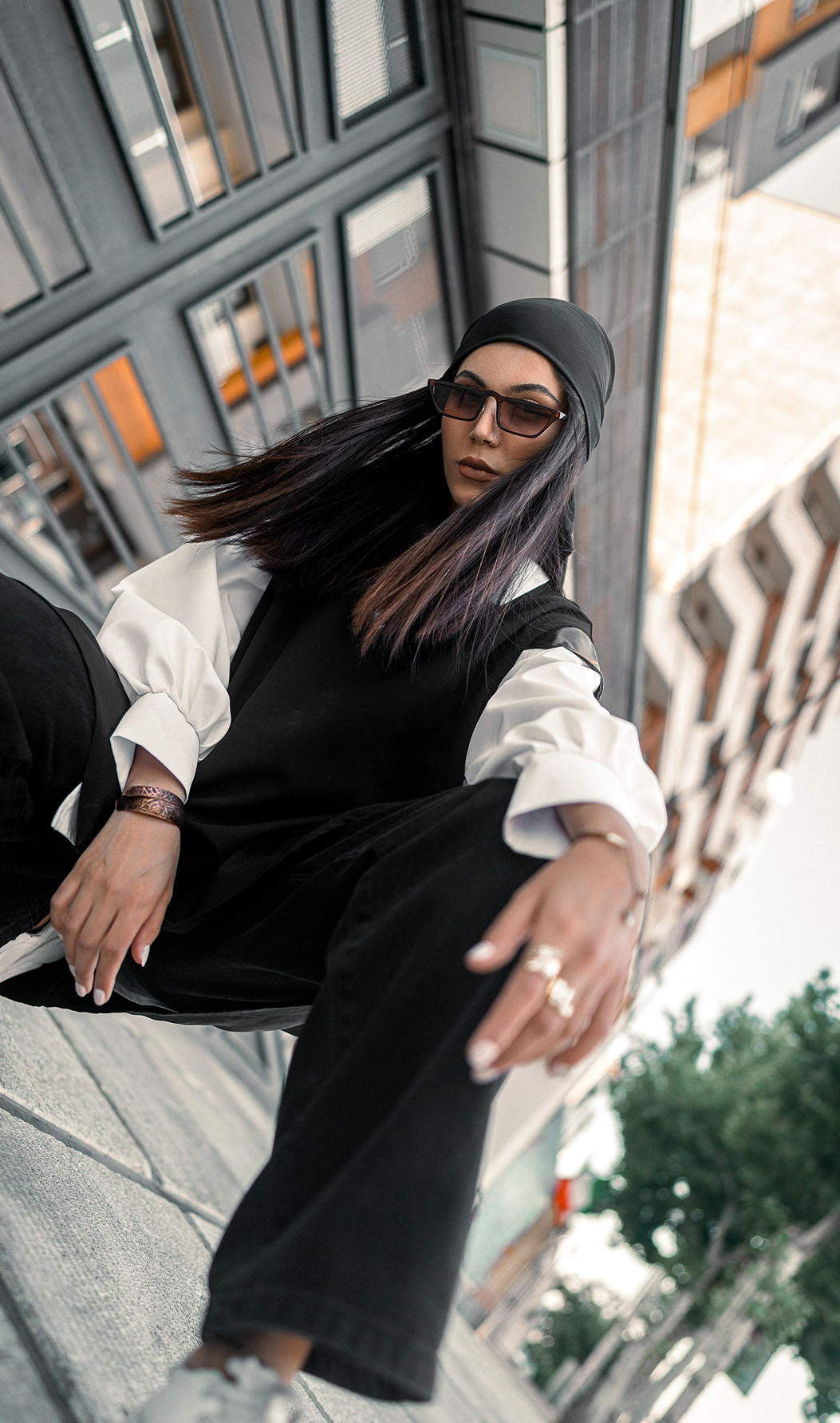 Model wearing an urban layered set with a shirt-inspired top and trousers