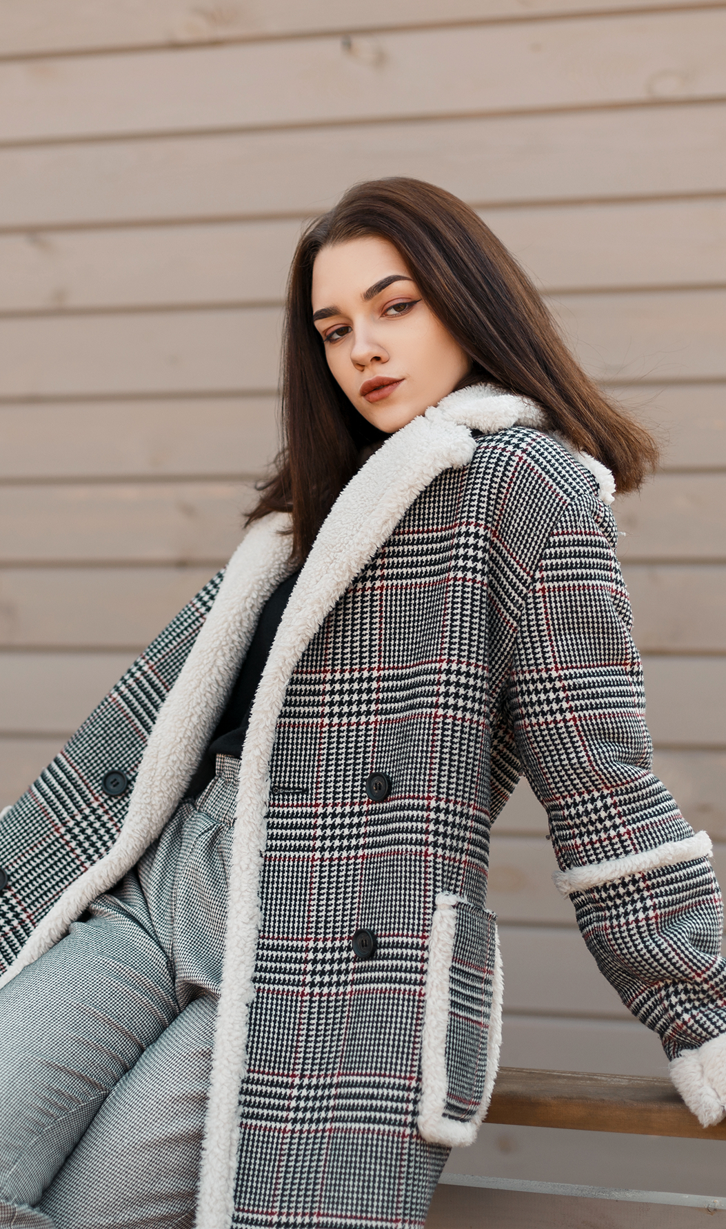Shearling check coat with soft trim, double-breasted front, and roomy pockets