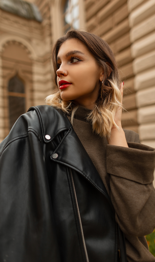 Classic biker jacket with snap-fastened lapels, zip closure, secure pockets, and a polished silhouette
