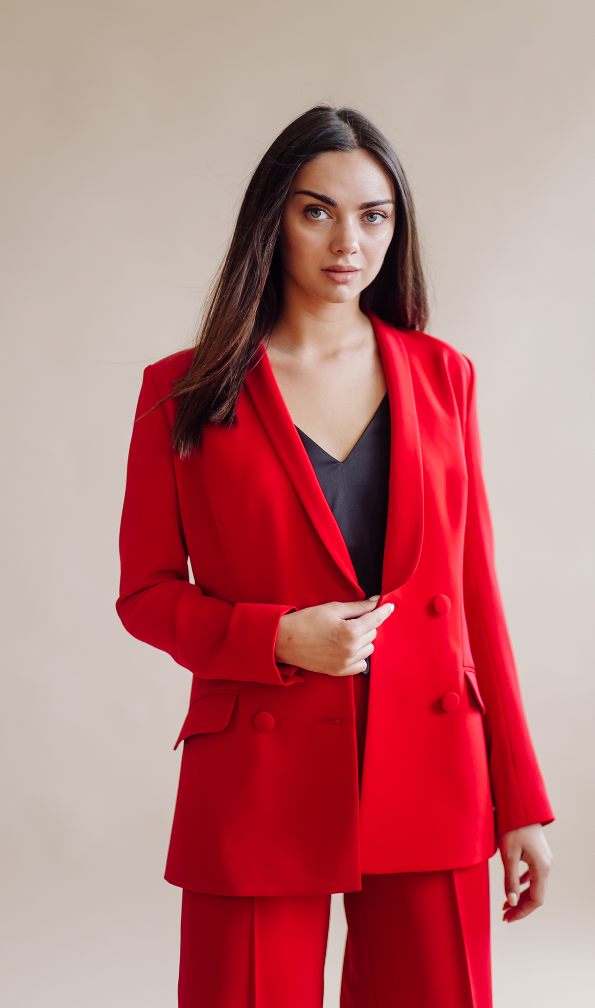 Double breasted blazer with clean lapels, structured shoulders, functional pockets, and polished tailored fit