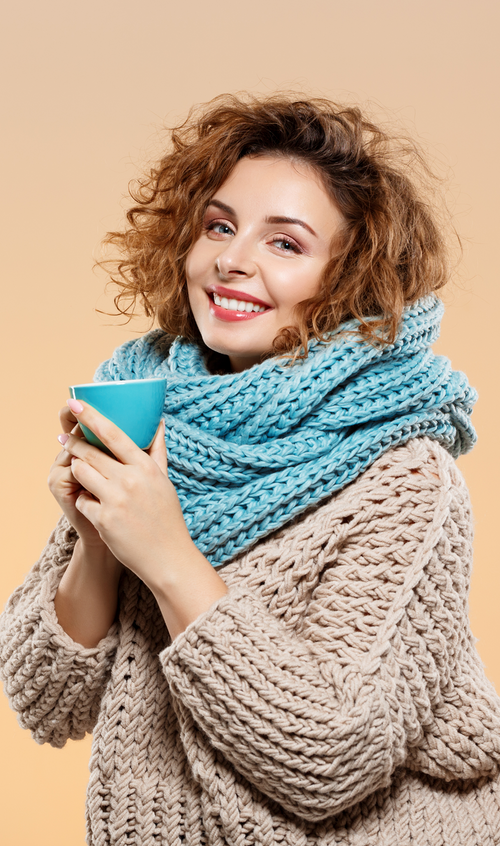 Chunky loop muffler with substantial knit texture, generous looped shape, and easy pull-on styling